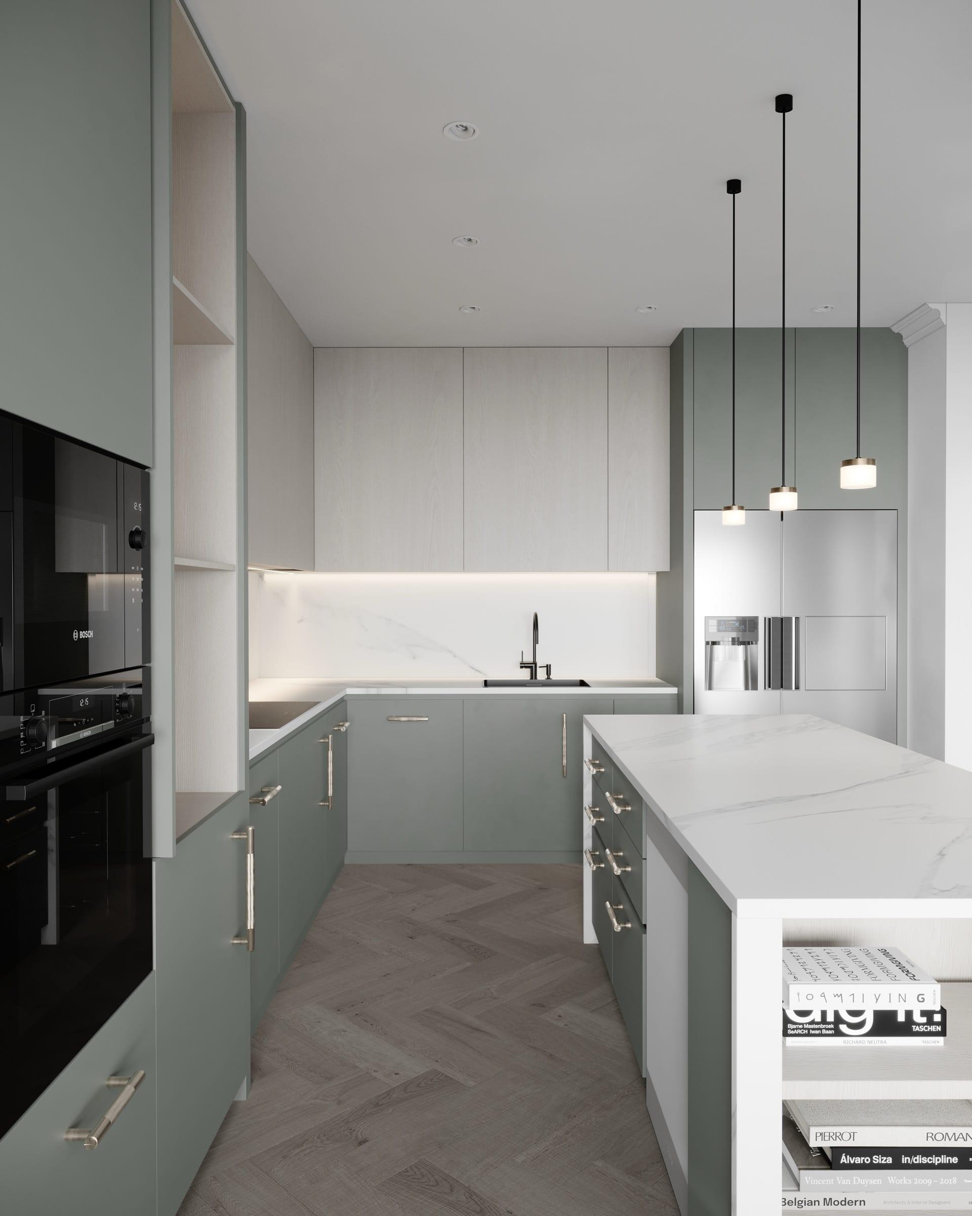 Sage-green kitchen with a marble island, black pendant lights and herringbone flooring