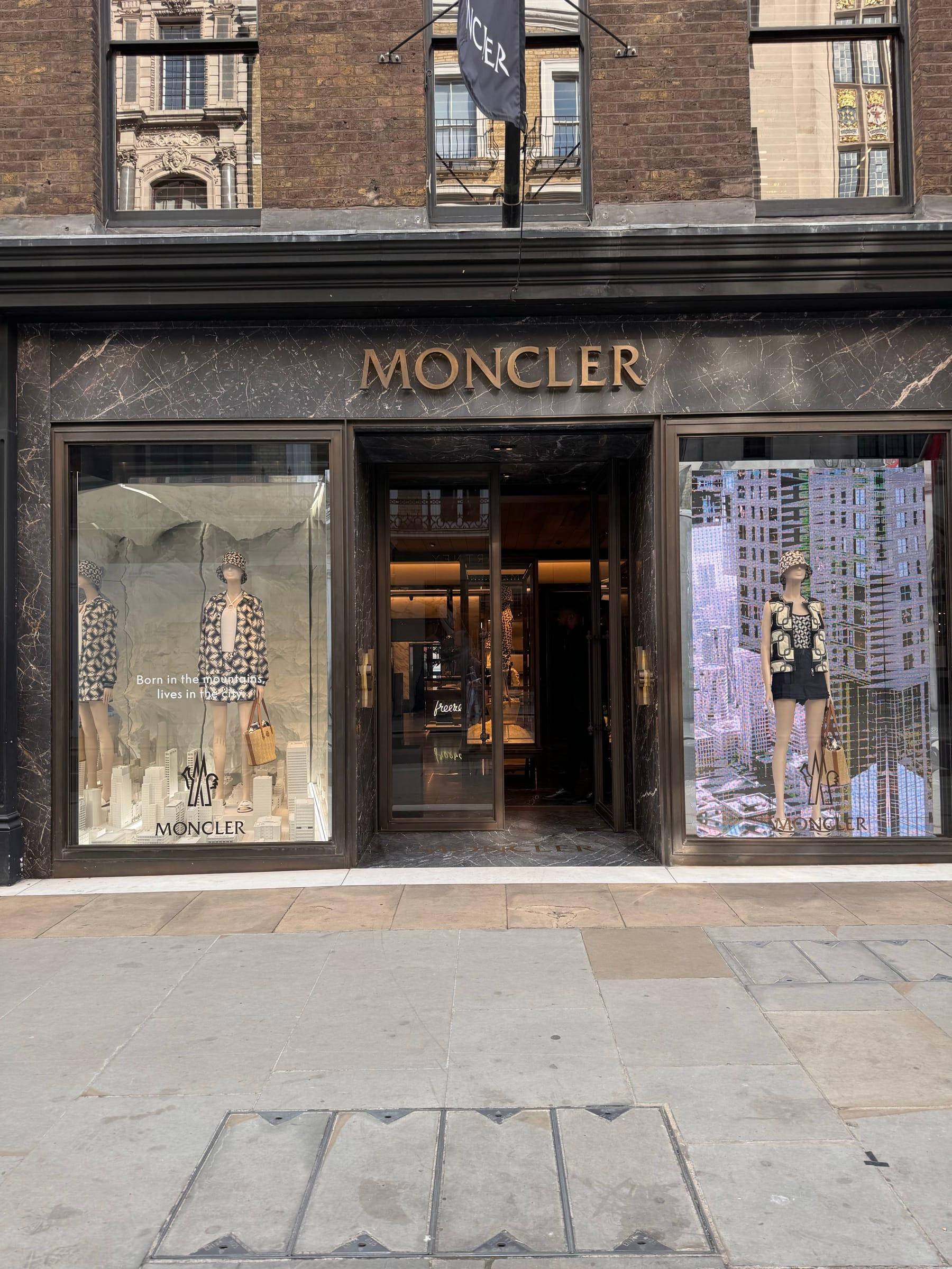 Moncler shopfront in stone and bronze on a London street