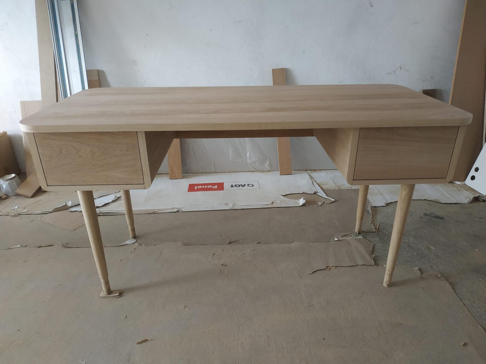 Oak writing desk with tapered legs and two drawers, finished in the workshop