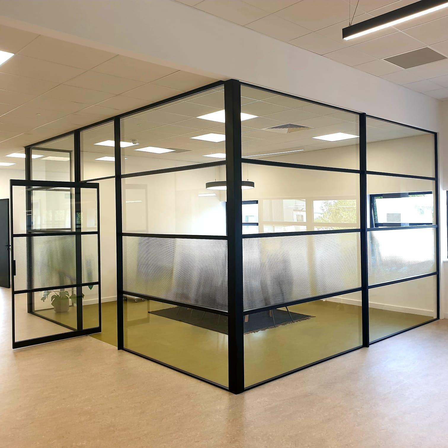 Office glazed partition in black steel framing, with a manifestation band across the glass